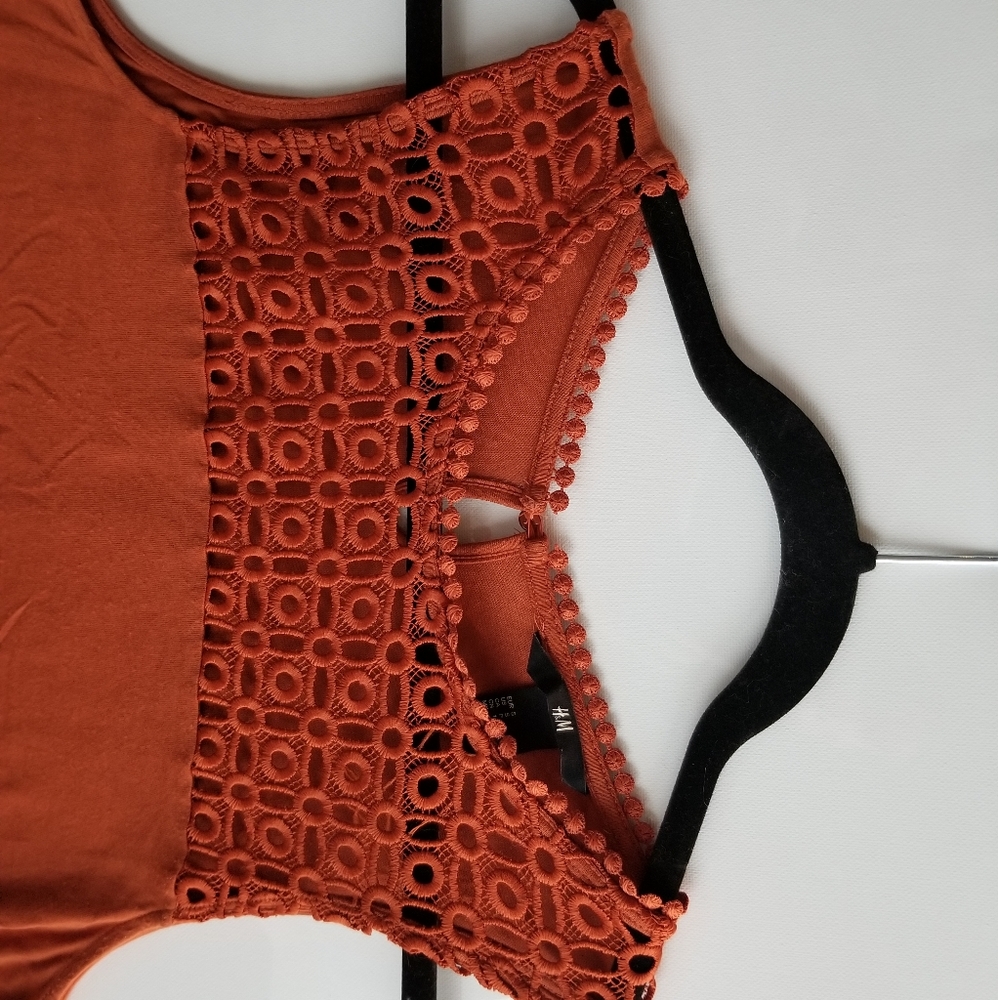 H & M top burnt orange/red fits small to medium